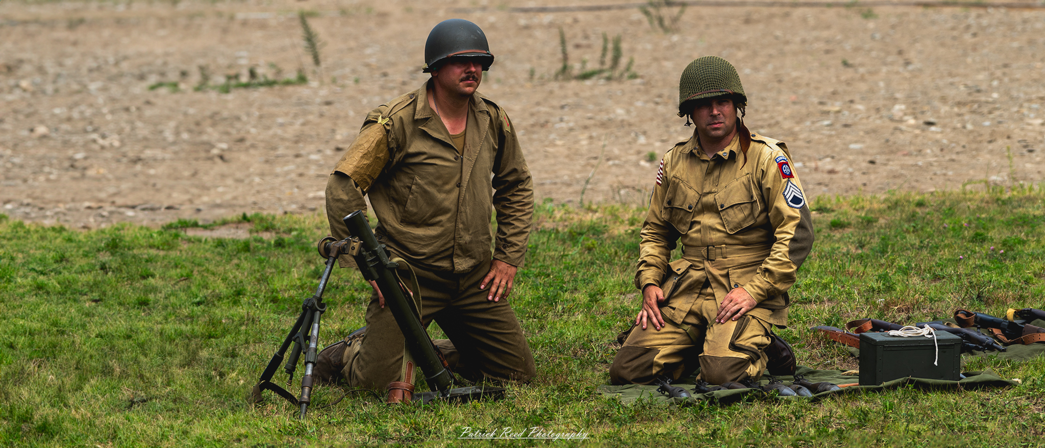 "An intense scene of two soldiers operating a mortar, working together to load and fire the weapon. Their teamwork and focus are evident as they prepare to launch a round, highlighting the precision and coordination required in this critical battlefield role."